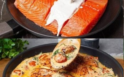 Hvidløgslaks i en cremet sauce med spinat og cherrytomater.
